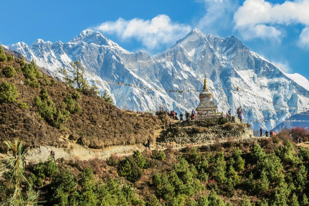 view-of-small stupa-trekking trial- beautiful-mountains-group-of-people-in-namche-bazaar-nepal.