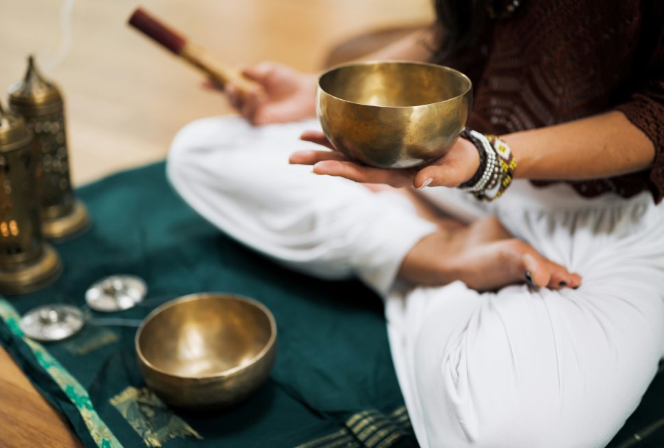 yoga trekking and sound healing in nepal where a man is taking the healing equipment for human