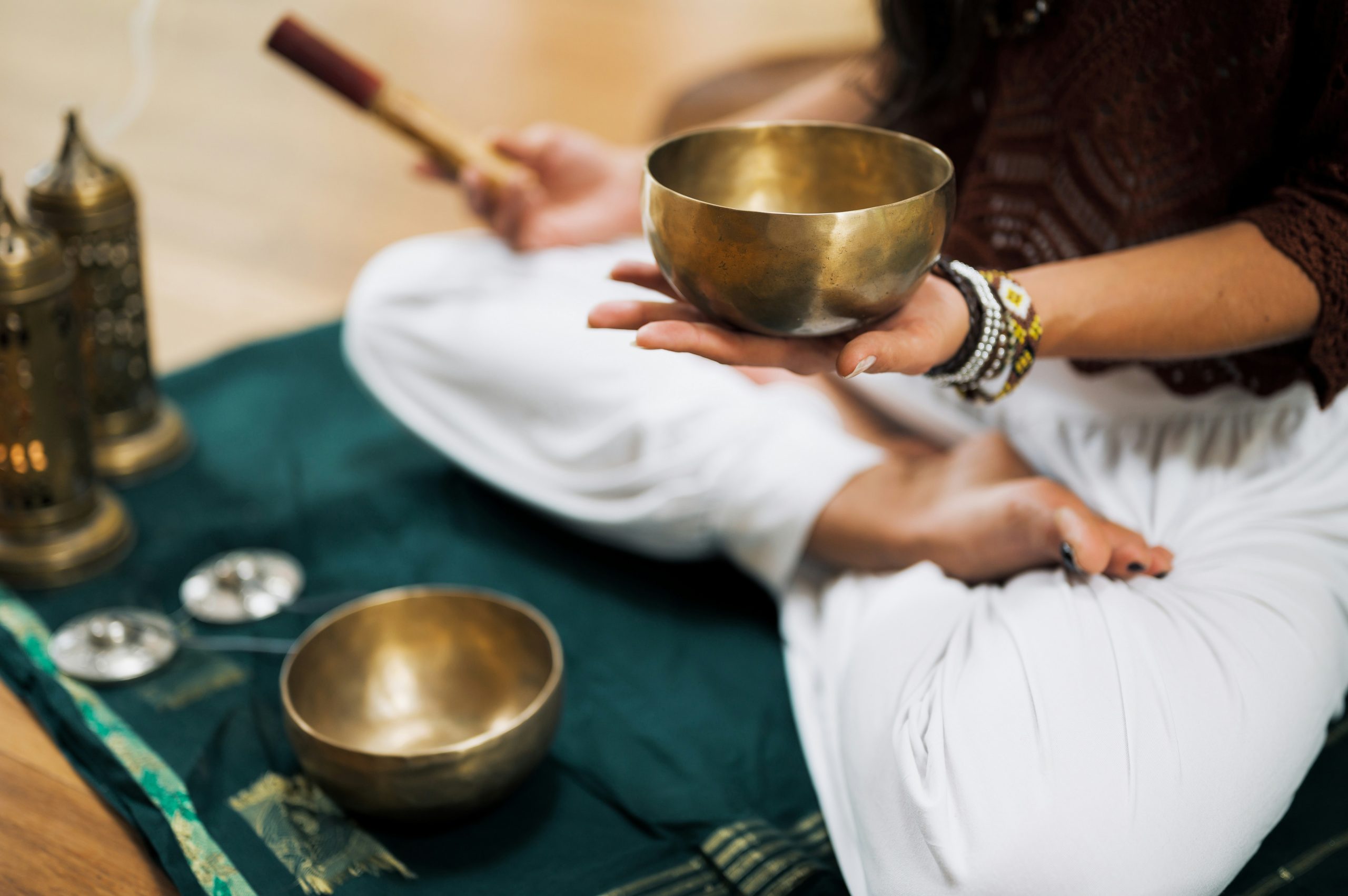 yoga trekking and sound healing in nepal where a man is taking the healing equipment for human