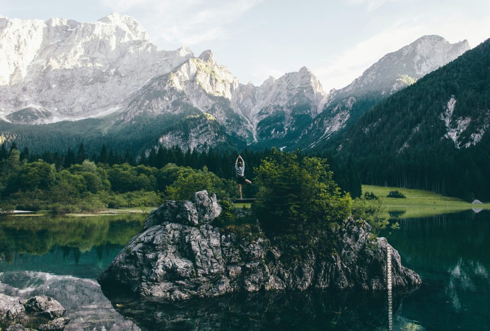 yoga-in-nature-in-front-of-mountain-among-trees