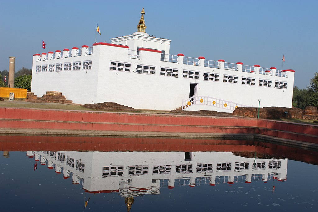 there is pond down the steps and on the level of the first step there is ground and on that ground there is lumbini house which is the birth place of gautam buddha and there is also the "Ashoka Piller" under the blue sky